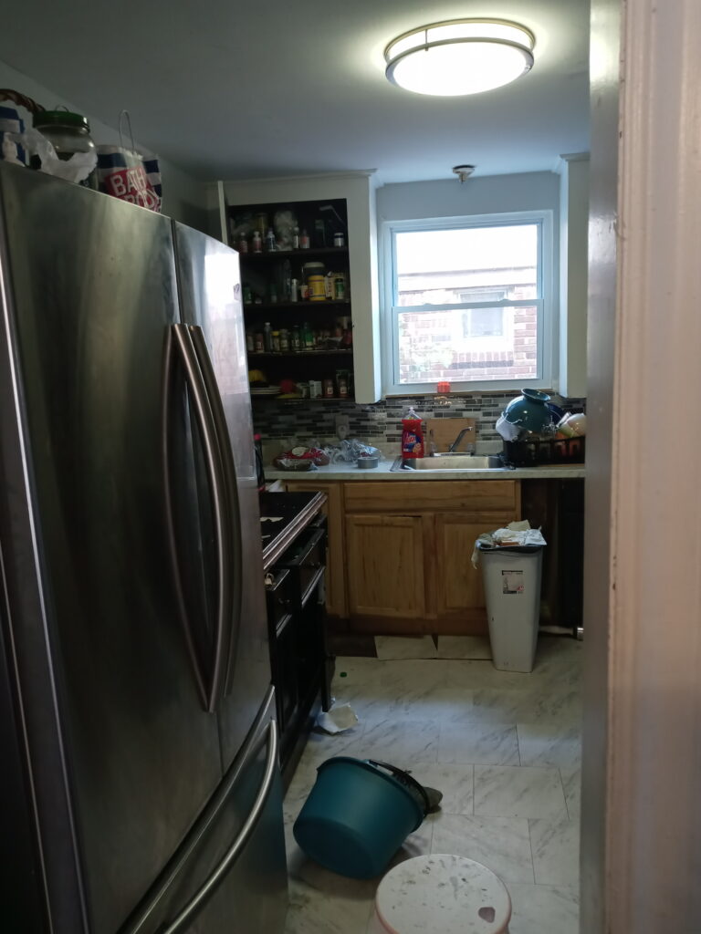 A kitchen view with a refrigerator