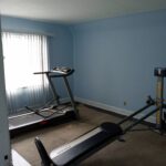 An empty room with gym equipment