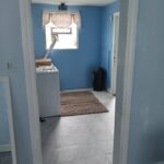 A small extra room with blue painted walls