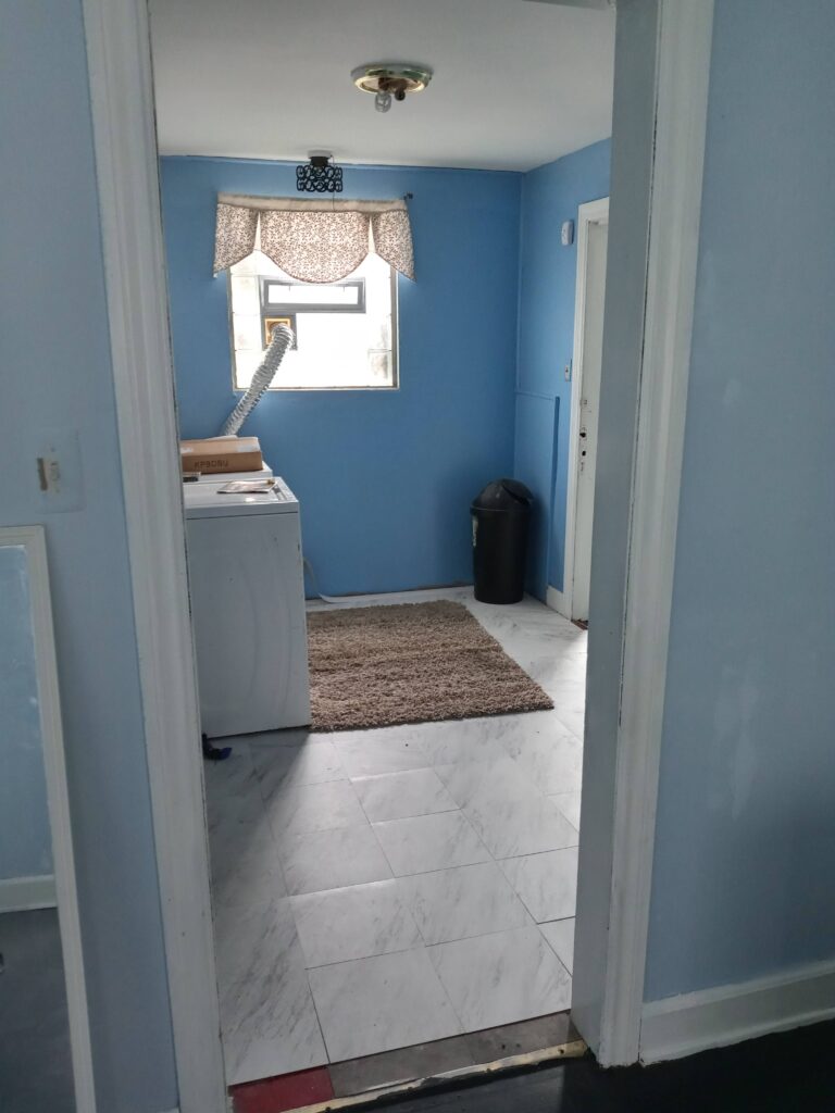 A small extra room with blue painted walls